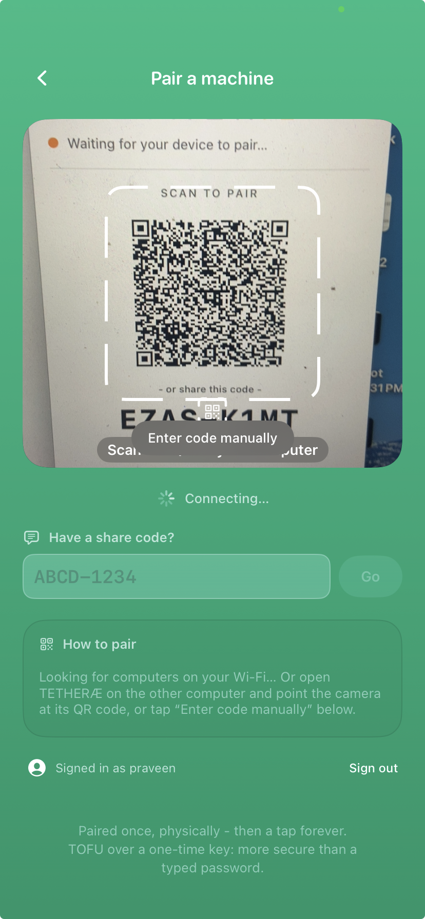 Pairing happens in person: the machine shows a code, the phone reads it.